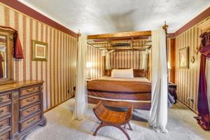a bedroom with a bed and a dresser at Yankton Apt 1 Mi to Mount Marty University! in Yankton