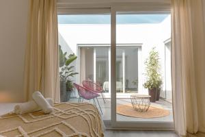 Ένα ή περισσότερα κρεβάτια σε δωμάτιο στο Marlin House VII +41 φωτογραφίες