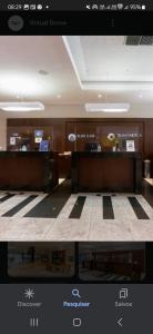 a picture of a lobby with a desk in a building at Flat no Beach Class Internacional, à beira-mar, em Boa Viagem, Recife-PE, com portaria e restaurante 24h - ideal para concursos, turismo, visto americano e jogos da série A - Piscina em reforma in Recife +16 photos