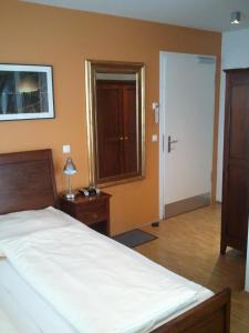 Postel nebo postele na pokoji v ubytování Heldts Aparthotel