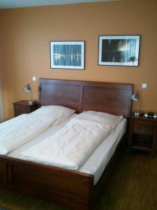 Postel nebo postele na pokoji v ubytování Heldts Aparthotel