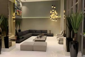 a living room with a couch and a table at Apartamento Super Luxo com vista in João Pessoa
