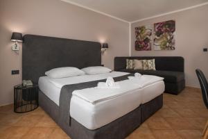 Postelja oz. postelje v sobi nastanitve Ljubljana Resort Hotel & Camping