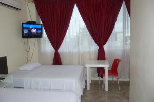Postel nebo postele na pokoji v ubytování Hostería Mar de Cristal
