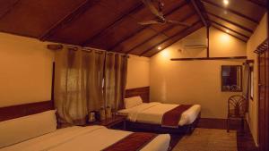 Postel nebo postele na pokoji v ubytování Safari Adventures Lodge