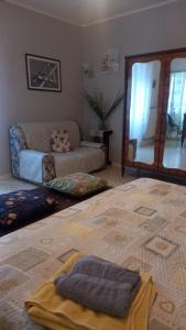 Postel nebo postele na pokoji v ubytování La Casetta di Anna + 8 fotografií