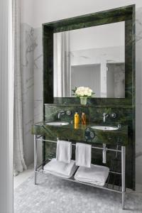 Ein Badezimmer in der Unterkunft Hôtel Métropole Genève