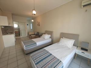 Postel nebo postele na pokoji v ubytování Marina Studio Appartments