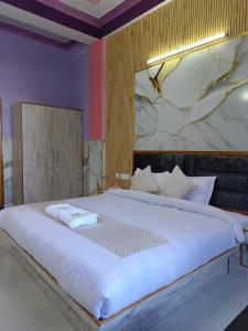 Postel nebo postele na pokoji v ubytování Hotel Ashoka B&B
