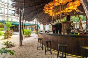 a bar in a building with stools at 3BR Penthouse with Private Plunge Pool in Tulum