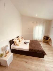 a bedroom with a large bed and a table at Lily House in Sainte-Marie