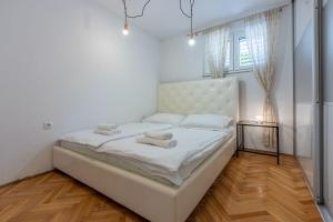 Ένα ή περισσότερα κρεβάτια σε δωμάτιο στο Herrliches Apartment nur 600 Meter zum Strand mit Meerblick, Pool, Grill, Waschmaschine +25 φωτογραφίες