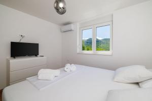 Postel nebo postele na pokoji v ubytování Atemberaubende Villa mit Whirlpool, Privatpool, Aussendusche, Fitnessraum, Waschmaschine + 32 fotografií