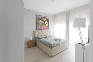A bed or beds in a room at Fabio's guesthouse&parking Még 16 kép