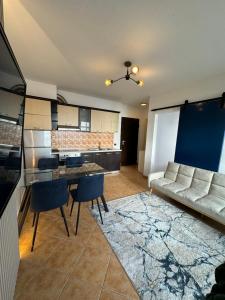 a living room with a couch and a table at Beach Front Superior Apartment Blue Marine in Durrës