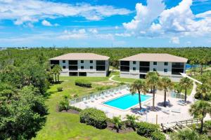 an aerial view of a resort with a swimming pool at Sandpiper Beach 101 in Sanibel