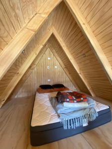 Ένα ή περισσότερα κρεβάτια σε δωμάτιο στο Cabañas ruka +1 φωτογραφίες