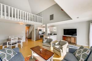 a living room with a couch and a table at Private Dock, Hot Tub Waterfront Ocean Pines Home in Ocean Pines