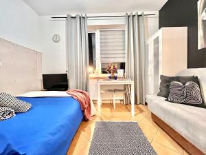 Posteľ alebo postele v izbe v ubytovaní Chopin apartments self check-in