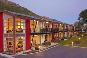 an exterior view of a building with a balcony at Marina Apartments - Element Escapes in Queenstown