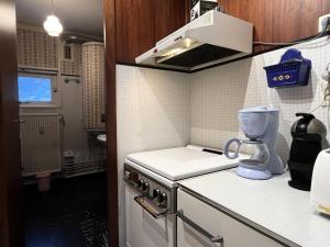 a small kitchen with a mixer on a counter at Résidence Bero Bisto - maeva Home - Studio 4 personnes - Confort MAE-1951 in La Mongie +1 photo