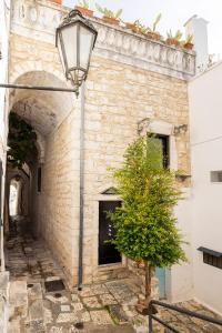 a street light in front of a brick building at Rifugio Del Monsignore in Ostuni