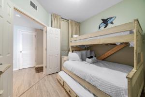 a bedroom with a bunk bed in a room at Beach Club B-1208 in Gulf Highlands +42 photos