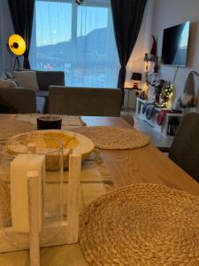 a dining room table with a view of a living room at The Tower - Lovely apartment @ Bansko Royal Towers in Bansko