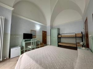 Postel nebo postele na pokoji v ubytování B&B La Corte