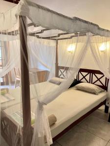 Ένα ή περισσότερα κρεβάτια σε δωμάτιο στο Palm Beach Guest House +14 φωτογραφίες