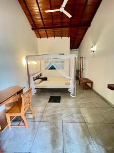 Ένα ή περισσότερα κρεβάτια σε δωμάτιο στο Palm Beach Guest House