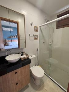 a bathroom with a toilet and a sink and a shower at Chalé Dunas Atins - Chalé de temporada em Atins in Barreirinhas