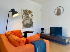 TV a/nebo společenská místnost v ubytování revLIVING Haus Clara am Berg mit kleinem Garten