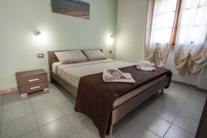 Posteľ alebo postele v izbe v ubytovaní Silvia Casa Vacanze