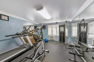 a gym with two treadmills and two tread machines at Best Western Harbour Inn & Suites Huntington - Sunset Beach in Huntington Beach
