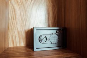 a small microwave oven sitting on a wooden floor at SOLEMN Cabañas Villaseñor in Tulum