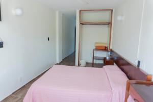 Ένα ή περισσότερα κρεβάτια σε δωμάτιο στο Hotel la fortuna