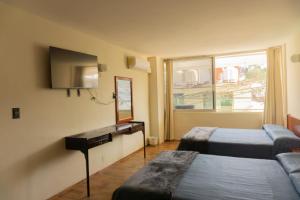 Ένα ή περισσότερα κρεβάτια σε δωμάτιο στο Hotel la fortuna