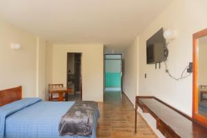 Ένα ή περισσότερα κρεβάτια σε δωμάτιο στο Hotel la fortuna +18 φωτογραφίες