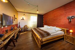 Postel nebo postele na pokoji v ubytování Hotel Freizeittempel