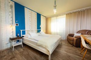 Postel nebo postele na pokoji v ubytování Hotel Freizeittempel