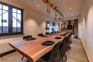 a large conference room with a long table and chairs at Villa Victoire in Heers