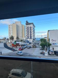 a city with cars parked in a parking lot at Reserva Madero 201 Vista Mar in Natal