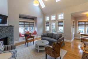a living room with a couch and a fireplace at The Newport Lofts - 611 Thames Street in Newport
