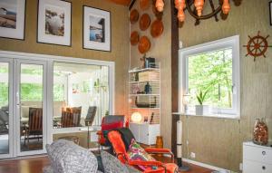 a living room with two chairs and a window at 3 Bedroom Amazing Home In Ronneby in Ronneby