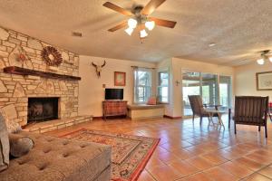 a living room with a couch and a fireplace at La Vista in Canyon Lake