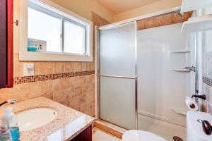 a bathroom with a shower and a sink at Canal-Front Home with Dock in Little Egg Harbor! in Little Egg Harbor Township +18 photos