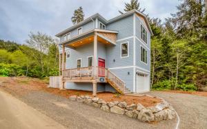 a house on the side of a road at Jims Folly in Depoe Bay