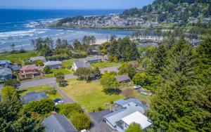 an aerial view of a house with the beach at The Boat House in Yachats