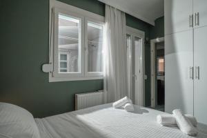 Ένα ή περισσότερα κρεβάτια σε δωμάτιο στο The perfect apartment 1